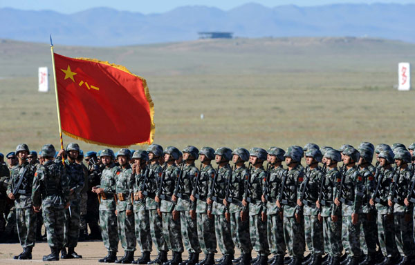 Chinese troops gather at the opening ceremony of the Peace Mission-2014 anti-terror drill at Zhurihe training base in North China's Inner Mongolia autonomous region on Sunday, August 24, 2014. [Photo/Xinhua]