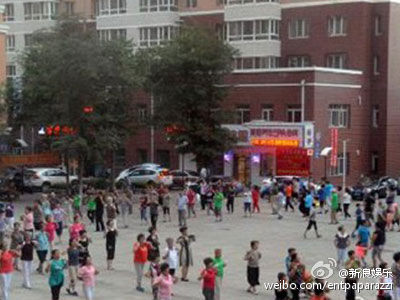 Photo from Sina Weibo shows square dancing near an apartment in Harbin, Heilongjiang province.