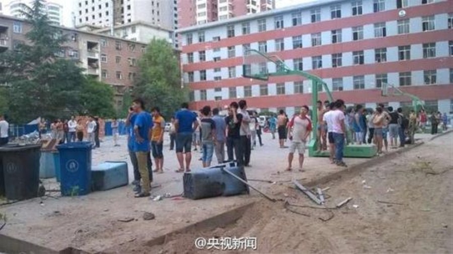 Students are evacuated to a basketball court after a blast hit a dorm building of Lanzhou University early this morning, causing 14 slightly injured.