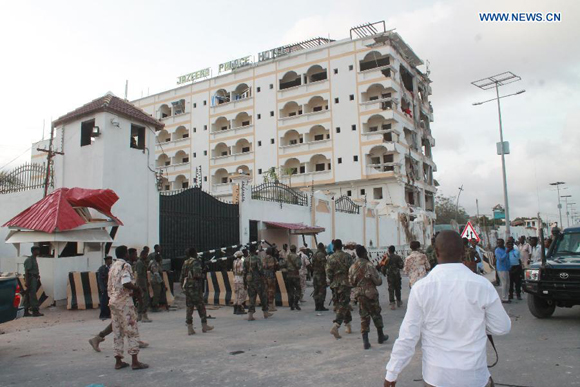 Photo taken on July 26, 2015 shows the Jazeera Hotel after a suicide attack in Mogadishu, Somalia. At least 15 people were killed and several others injured Sunday in a hotel blast in the Somali capital Mogadishu, police said. [Photo/Xinhua]