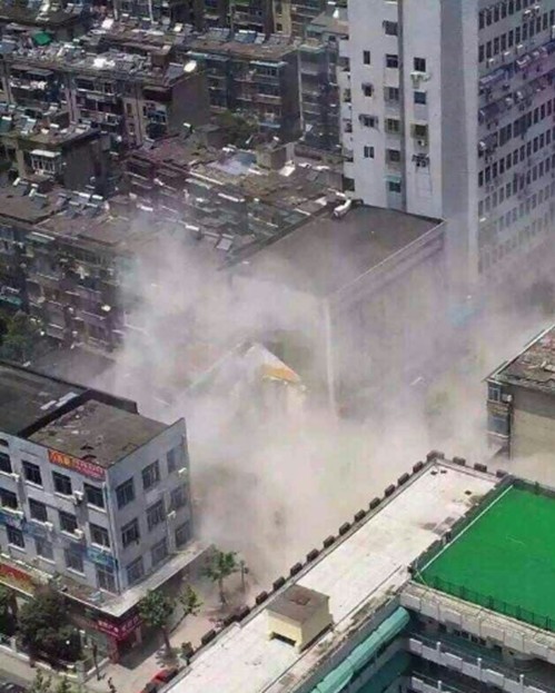 A multi-storey building collapses on July 27 in east China's Zhejiang Province. [Photo: weibo.com]