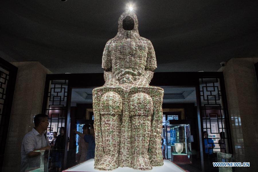 Photo taken on July 29, 2015 shows visitors at Beijing Guozhong Ceramic Art Center in Beijing, capital of China, July 29, 2015. 