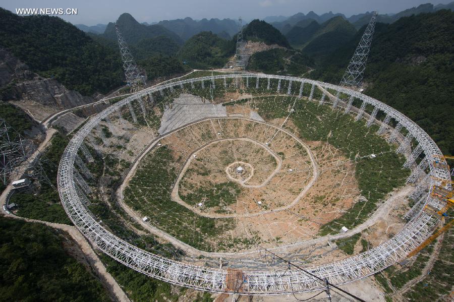 Photo taken on July 27, 2015 shows the assembly site of the five hundred meter aperture spherical telescope 'FAST' in Pingtang county of southwest China's Guizhou province. Once completed, it's going to be the world's largest radio telescope. [Photo: Xinhua] 