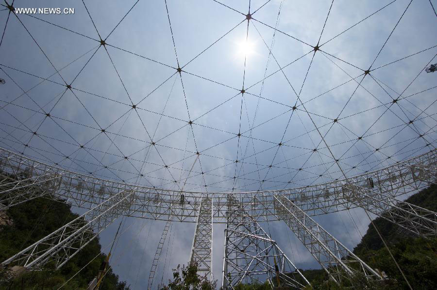 Photo taken on July 27, 2015 shows the cable net of the single-aperture spherical telescope 'FAST' in Pingtang county of southwest China's Guizhou province. [Photo: Xinhua] 