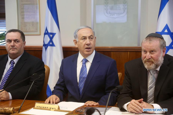 Israeli Prime Minister Benjamin Netanyahu (C) addresses the weekly cabinet meeting at the Prime Minister's office in Jerusalem, on Aug. 2, 2015. The Israeli security cabinet on Sunday called for a crackdown on Jewish extremists with harsher measures following an arson attack which killed a Palestinian toddler. [Photo/Xinhua]