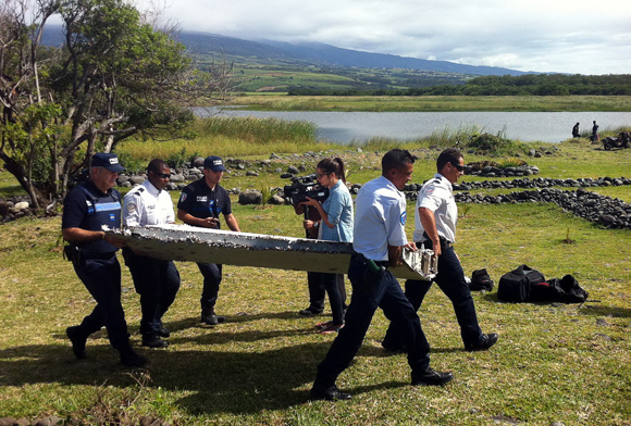 Investigators from France and Malaysia met Monday afternoon in the Palais de Justice to coordinate the investigation on the place wreckage found last Wednesday on Reunion Island, which may belong to the Boeing 777 plane of the missing MH370 flight. [Photo/Xinhua]