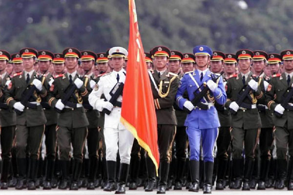 The file photo taken in 1999 shows the guard of honor of the three services of the PLA attending a parade to celebrate the 50th anniversary of the founding of the People's Republic of China in Beijing. [Photo/Xinhua]