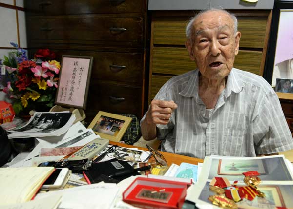 Kobayashi Kancho tells the truth of the invasion history while being interviewed in Tokyo, Aug 12, 2015. [Photo/Xinhua]