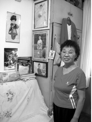 Gao Fenggqin poses for a picture at home in Haerbin, Heilongjiang Province in 2011.