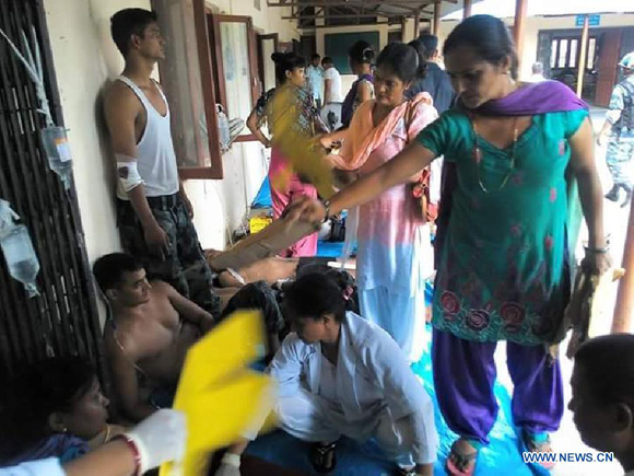 Injured police officers receive treatment in Tikapur hospital of Kailali district, Nepal, Aug. 24, 2015. At least 17 police personnel and three protesters were killed in a clash taking place in Tikapur of Kailali district on Monday afternoon. [Photo/Xinhua]