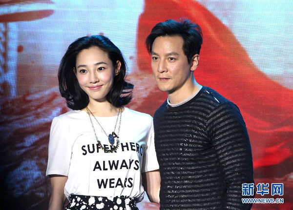 Actor Daniel Wu (R) and actress Bai Baihe attend the press conference of movie 'Go Away Mr. Tumor' in Beijing, on March 15, 2015. [Xinhua]