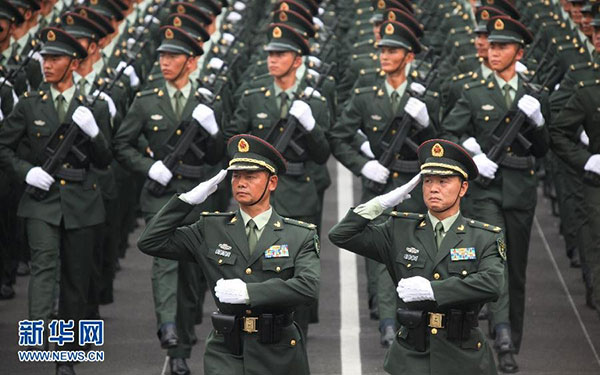 Major General Cheng Xiangwen (Left) and Major General Zhu Yunxuan (right) salute during a session with soldiers from their marching unit on July 22, 2015. They are preparing for the Sept 3 military parade to mark the 70th anniversary of victory in the War of Resistance Against Japanese Aggression. [Photo/mod.gov.cn] 