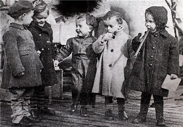 George Cautherley (left) and other young ex-internees arriving in the United Kingdom following their release from the Stanley Internment Camp. Provided to China Daily