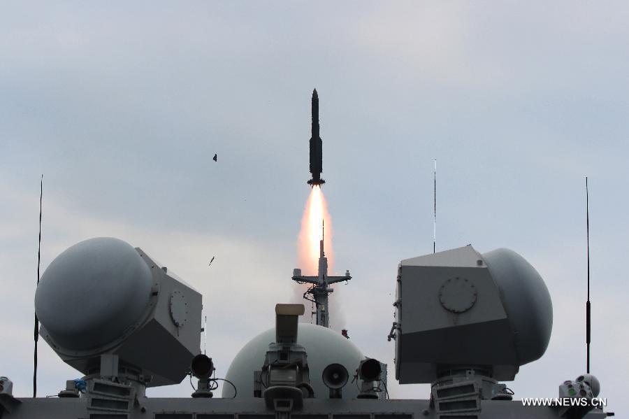 An air-defense missile is launched from missile frigate 'Changzhou' during a fire drill in the East China Sea, Aug. 27, 2015.