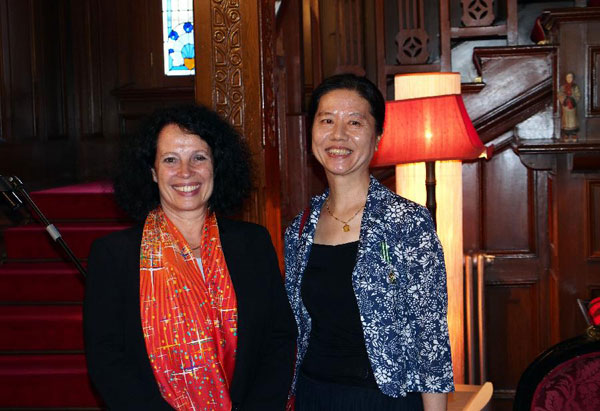 French ambassador to China Sylvie Bermann (L) poses for a photo with Wang Anyi in Shanghai on Sept. 26, 2013. Wang was awarded Knight of the Order of Arts and Letters by France on that day. [Xinhua]