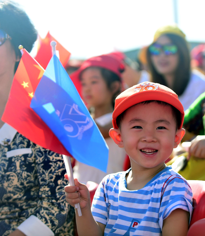 A little boy is seen among the audience watching the military parade on Sept. 3 on the Tian&apos;anmen Square in Beijing, capital of China. [Photo/Xinhua]