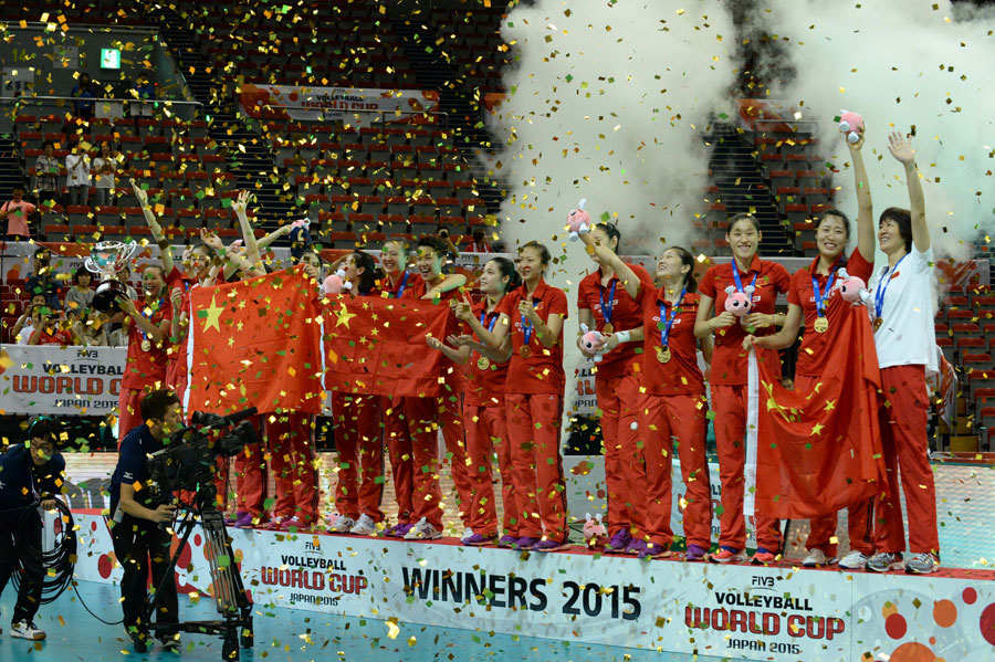 Team of China celebrate during the awarding ceremony of 2015 Women's Volleyball World Cup in Nagoya, Japan, Sept. 6, 2015. China beat Japan in the final by 3-1 and claimed the title of the event. [Xinhua]