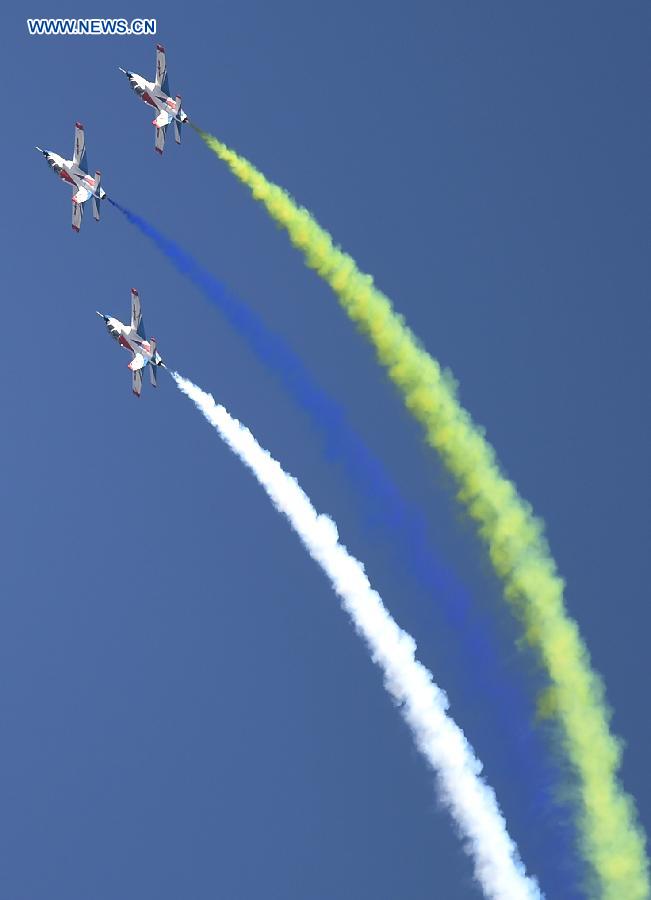 The 'Tianzhiyi' aerobatic aircrafts from the Aviation University of Air Force perform at the Dafangshen Airport in Changchun, capital of northeast China's Jilin Province, Sept. 10, 2015. The Aviation Open Day of the Air Force of the CPLA and the opening ceremony for the Aviation University of Air Force was held here on Thursday. [Xinhua]