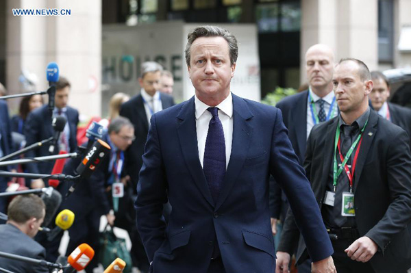 British Prime Minister David Cameron arrives to attend an European Union (EU) emergency summit on the migration crisis at EU Headquarters in Brussels, Belgium, Sept. 23, 2015. (Xinhua/Ye Pingfan)