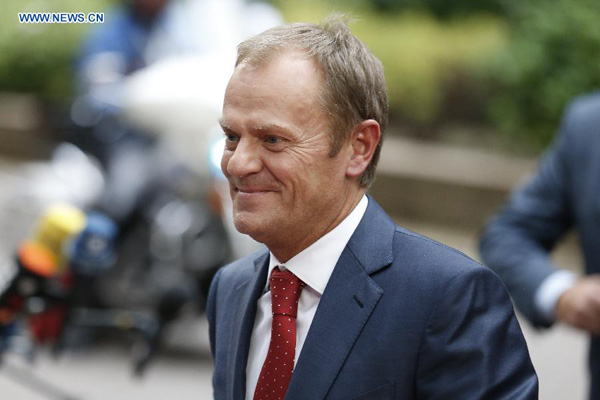 European Council President Donald Tusk arrives to attend an European Union (EU) emergency summit on the migration crisis at EU Headquarters in Brussels, Belgium, Sept. 23, 2015. (Xinhua/Ye Pingfan)