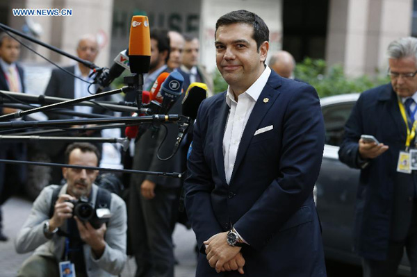 Greek Prime Minister Alexis Tsipras arrives to attend an European Union (EU) emergency summit on the migration crisis at EU Headquarters in Brussels, Belgium, Sept. 23, 2015. (Xinhua/Ye Pingfan)