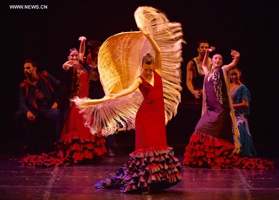 Dancers from Spanish Aida Gomez dancing troupe perform Spanish flamenco dance drama 'Carmen' at the National Center for the Performing Arts in Beijing, capital of China, Oct. 4, 2015. Based on a novella of the same title by Prosper Merimee, Carmen is one of the most popular operas of Bizet. [Photo/Xinhua] 