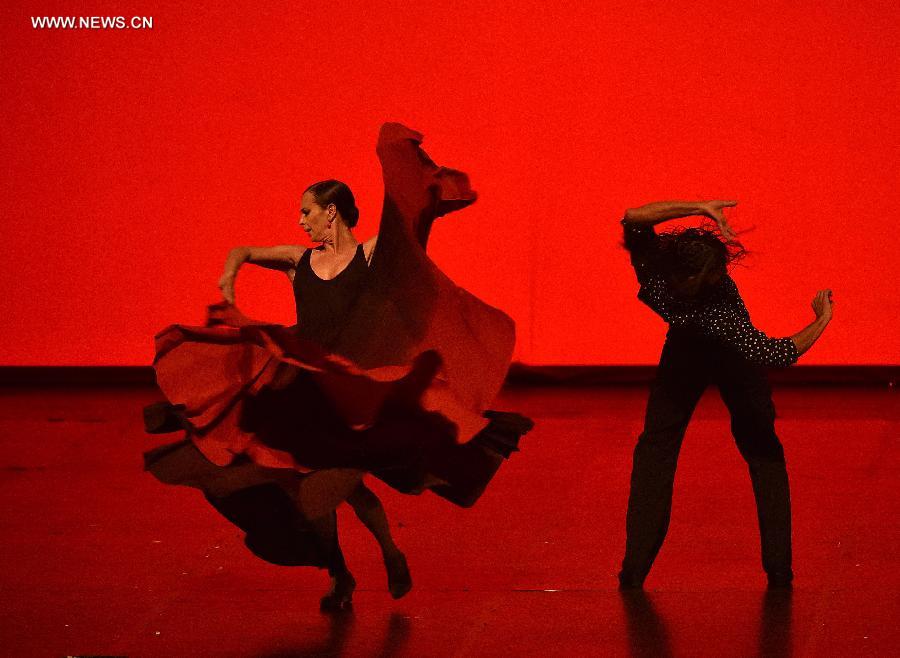 Dancers from Spanish Aida Gomez dancing troupe perform Spanish flamenco dance drama 'Carmen' at the National Center for the Performing Arts in Beijing, capital of China, Oct. 4, 2015. Based on a novella of the same title by Prosper Merimee, Carmen is one of the most popular operas of Bizet. [Photo/Xinhua] 