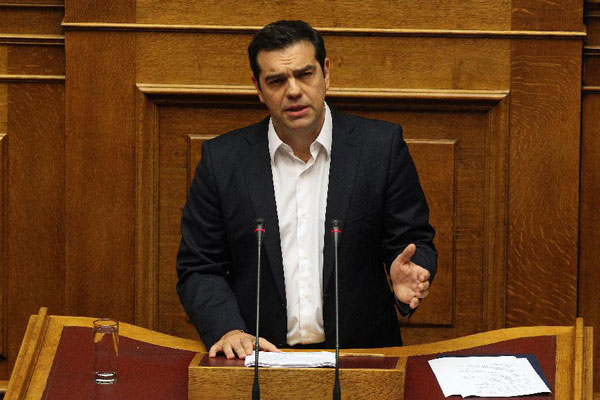 Greek Prime Minister Alexis Tsipras addresses Parliament on government policy statements in Athens, Greece, on Oct. 5, 2015. [Xinhua]