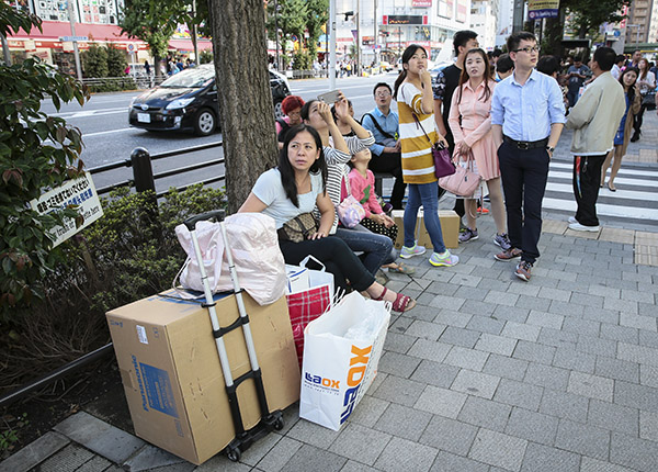 Chinese shoppers in the Akihabara electronics shopping district in Tokyo on Friday. [Photo provided to China Daily]
