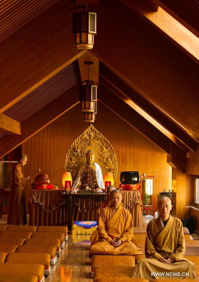 Monks sit in meditation in Longquan Monastery in Beijing, capital of China, Sept. 27, 2015. [Xinhua]