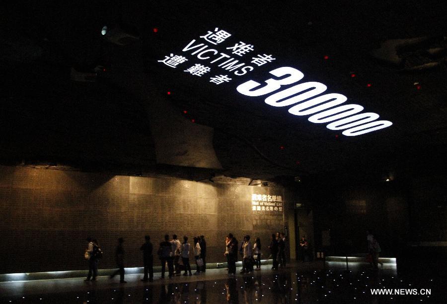 People visit the Memorial Hall of the Victims in Nanjing Massacre by Japanese Invaders in Nanjing, capital of east China's Jiangsu Province, Oct. 7, 2015. Documents of the Nanjing Massacre from China were inscribed on the Memory of the World Register by the International Advisory Committee of UNESCO's Memory of the World Programme, UNESCO announced on Oct. 9 in a press release. [Xinhua]