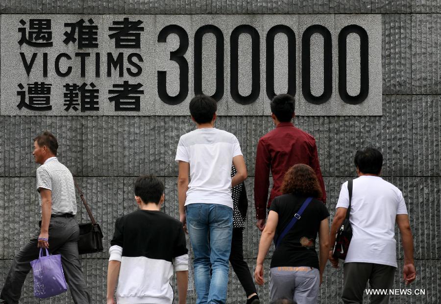 People visit the Memorial Hall of the Victims in Nanjing Massacre by Japanese Invaders in Nanjing, capital of east China's Jiangsu Province, Sept. 17, 2015. Documents of the Nanjing Massacre from China were inscribed on the Memory of the World Register by the International Advisory Committee of UNESCO's Memory of the World Programme, UNESCO announced on Oct. 9 in a press release. [Xinhua]