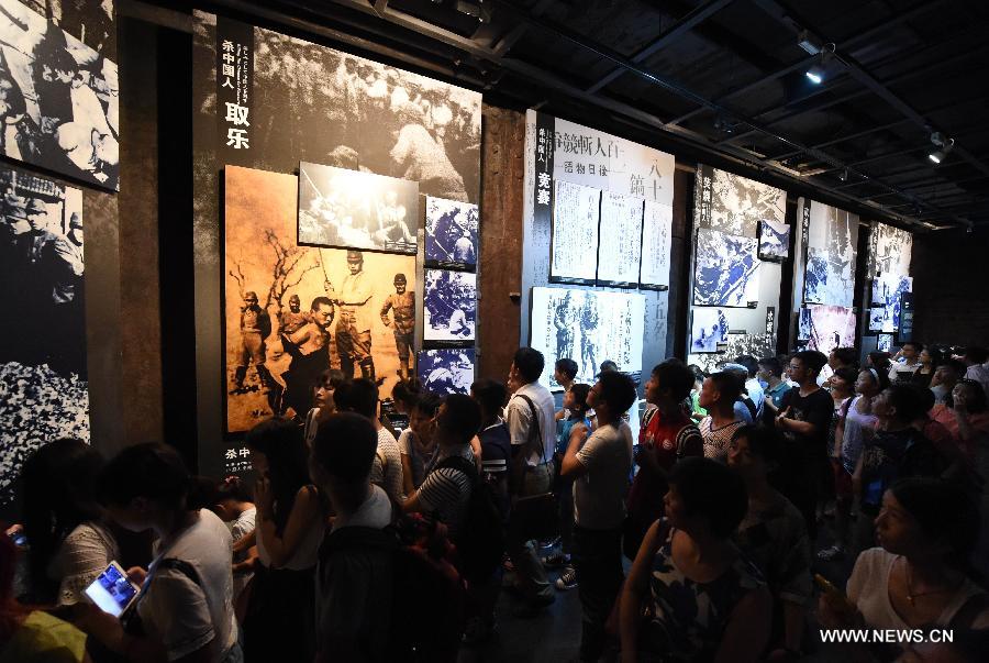 People visit the Memorial Hall of the Victims in Nanjing Massacre by Japanese Invaders in Nanjing, capital of east China's Jiangsu Province, Aug. 15, 2015. Documents of the Nanjing Massacre from China were inscribed on the Memory of the World Register by the International Advisory Committee of UNESCO's Memory of the World Programme, UNESCO announced on Oct. 9 in a press release. [Xinhua]