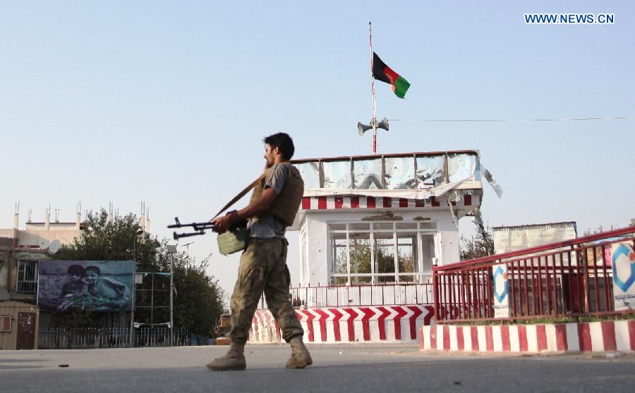 A policeman walks during a military operation in Kunduz city, Afghanistan, Oct. 9, 2015. Fierce clashes erupted between the security forces and Taliban insurgents Friday night on the southern outskirts of Kunduz city, capital of Afghanistan's northern province of Kunduz, police said. [Xinhua]