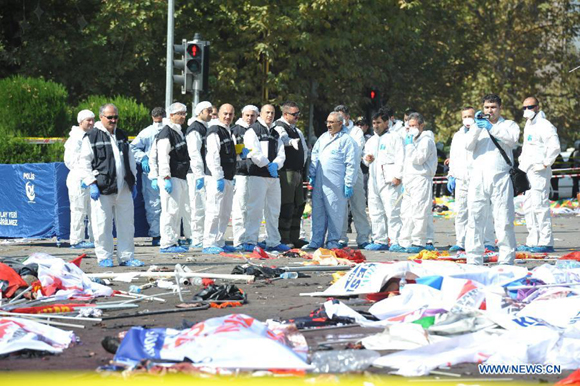 Medical workers clean up the accident site in Ankara, capital of Turkey, on Oct. 10, 2015. Death toll of the deadly twin blasts that hit a train station in the Turkish capital Ankara on Saturday rose to 95, according to an official statement issued by the office of Prime Minister Ahmet Davutoglu.[Photo/Xinhua] 