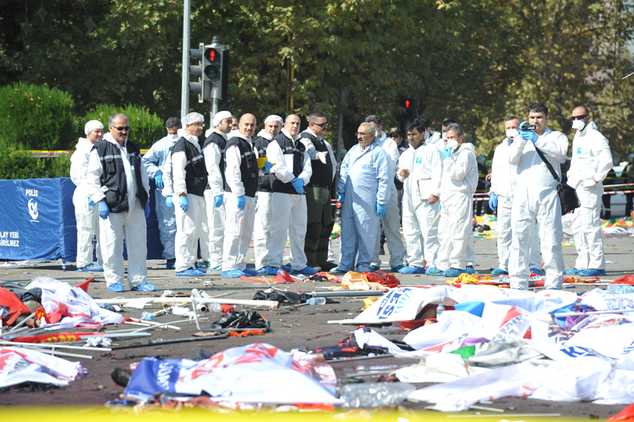 Medical workers clean up the accident site in Ankara, capital of Turkey, on Oct. 10, 2015. Death toll of the deadly twin blasts that hit a train station in the Turkish capital Ankara on Saturday rose to 95, according to an official statement issued by the office of Prime Minister Ahmet Davutoglu. [Photo/Xinhua] 