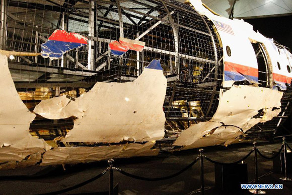 Wreckage of flight MH17 is seen after the presentation of the investigation report on the cause of its crash, at the Gilze-Rijen air base, the Netherlands, on Oct. 13, 2015. [Photo/Xinhua]