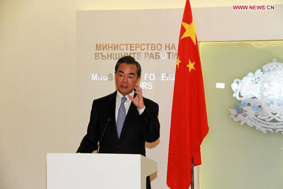 Chinese Foreign Minister Wang Yi speaks at a joint press conference held with Bulgarian Foreign Minister Daniel Mitov (not pictured) after their meeting in Sofia Oct. 15, 2015. [Photo/Xinhua]