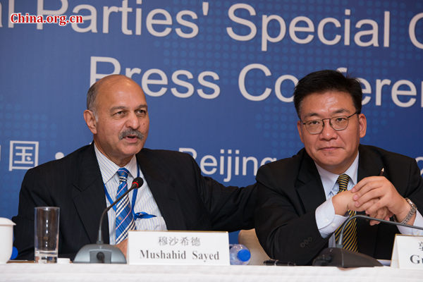 Guo Yezhou (R), Vice Minister of IDCPC and Mushahid Sayed, the Secretary-General of the Pakistan Muslim League and a senator of Pakistan, meet the press after the Asian Political Parties' Special Conference on the Silk Road concludes on Oct. 16 in Beijing. [Photo by Chen Boyuan / China.org.cn]