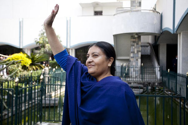 Vice-Chairperson of the Communist Party of Nepal (Unified Marxist-Leninist) (CPN-UML) Bidhya Devi Bhandari waves after voting at the Parliament in Kathmandu, Nepal, Oct. 28, 2015.[Photo/Xinhua]