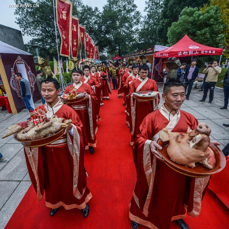 A ceremony to celebrate the brewing of yellow rice wine is held in Shaoxing, east China's Zhejiang Province, on Nov. 8, 2015, also the 19th solar term -- the Beginning of Winter. As winter begins, it comes to the best season of a year for brewing rice wine in Shaoxing. With a history of more than 2,500 years, Shaoxing rice wine is still produced with traditional method of brewing, which was listed as a national intangible cultural heritage in 2006. [Xinhua]