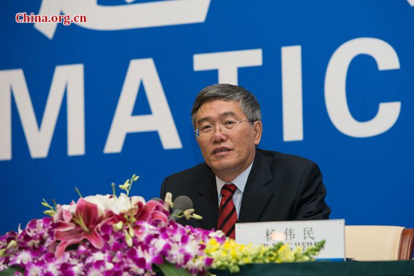 Yang Weimin, deputy director of the Office of the Central Leading Group on Financial and Economic Affairs, speaks during the briefing. [Photo by Chen Boyuan/China.org.cn]
