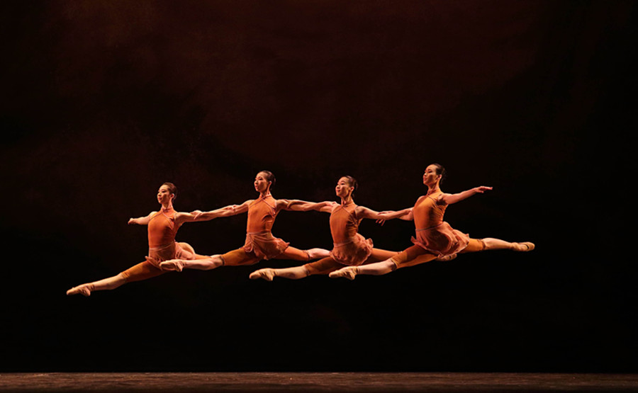 Four dancers leap through the air during the gala's grand finale, the Chinese original ballet, The Yellow River, by the National Ballet of China. [Photo provided to chinadaily.com.cn]