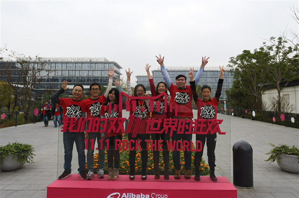 Workers of Alibaba retail websites Tmall and Taotao cheer for their marketing extravaganza, the Singles Day sale event at Alibaba headquarters yesterday in Hangzhou. Alibaba has rebranded its Singles' Day event today as the Global Shopping Festival as it seeks to draw in more international merchants and shoppers.[Xinhua]