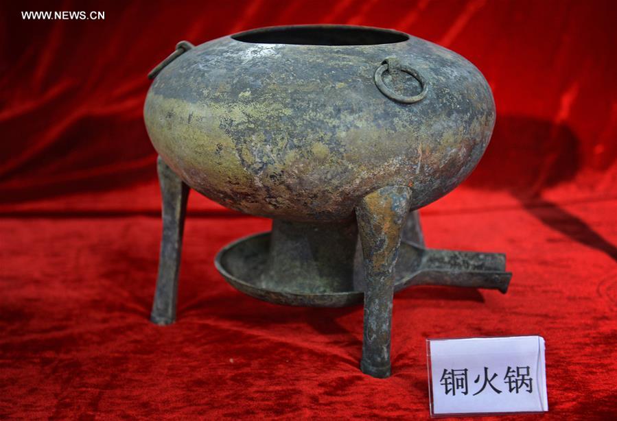 Photo taken on Nov. 6, 2015 shows a bronze pot unearthed from the excavation site of royal tombs of Marquis of Haihun State during the West Han Dynasty (206 B.C.--25 A.D.) in Nanchang, capital of east China's Jiangxi Province. 