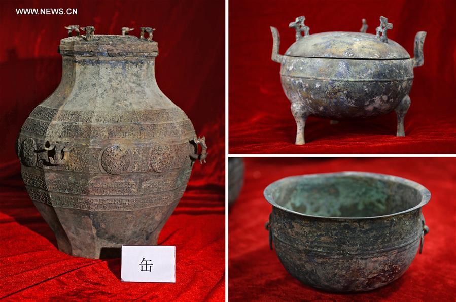 Combined photos taken on Nov. 6, 2015 shows bronze ware unearthed from the excavation site of royal tombs of Marquis of Haihun State during the West Han Dynasty (206 B.C.--25 A.D.) in Nanchang, capital of east China's Jiangxi Province. 