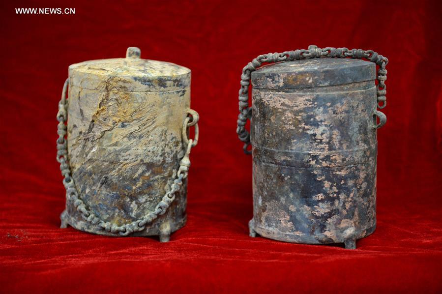 Photo taken on Nov. 6, 2015 shows pots unearthed from the excavation site of royal tombs of Marquis of Haihun State during the West Han Dynasty (206 B.C.--25 A.D.) in Nanchang, capital of east China's Jiangxi Province.