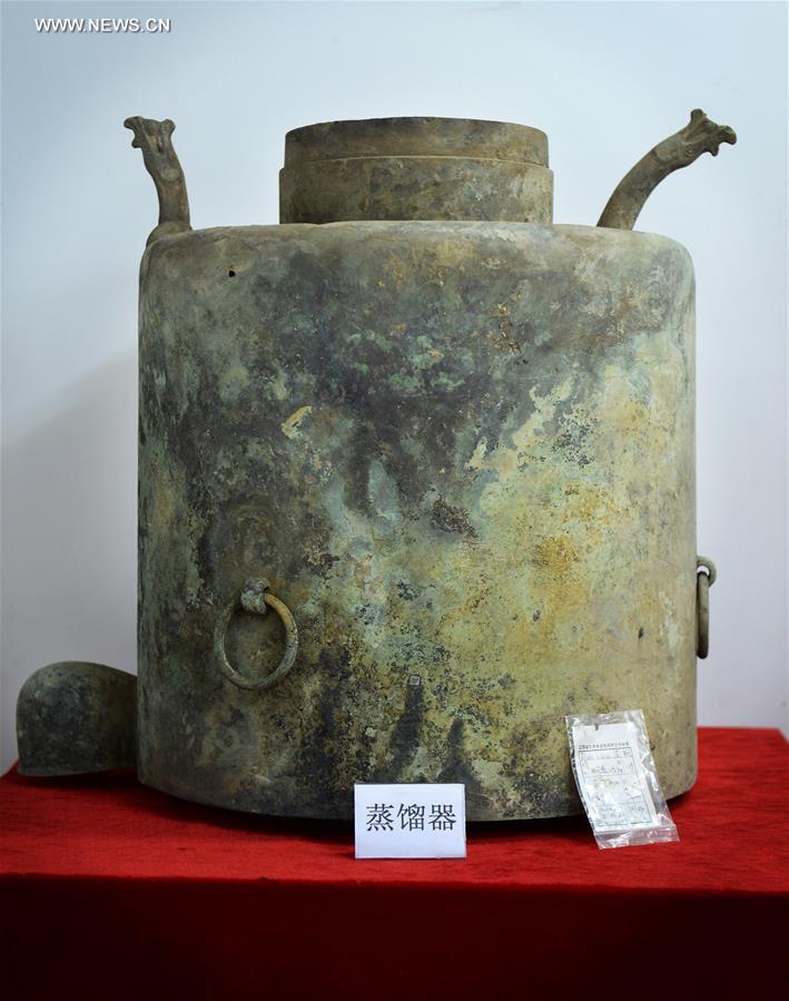 Photo taken on Nov. 6, 2015 shows a bronze distiller unearthed from the excavation site of royal tombs of Marquis of Haihun State during the West Han Dynasty (206 B.C.--25 A.D.) in Nanchang, capital of east China's Jiangxi Province. 