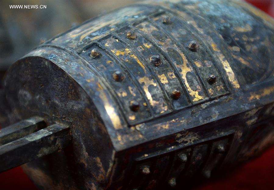 Photo taken on Nov. 6, 2015 shows details of a chime unearthed from the excavation site of royal tombs of Marquis of Haihun State during the West Han Dynasty (206 B.C.--25 A.D.) in Nanchang, capital of east China's Jiangxi Province. 