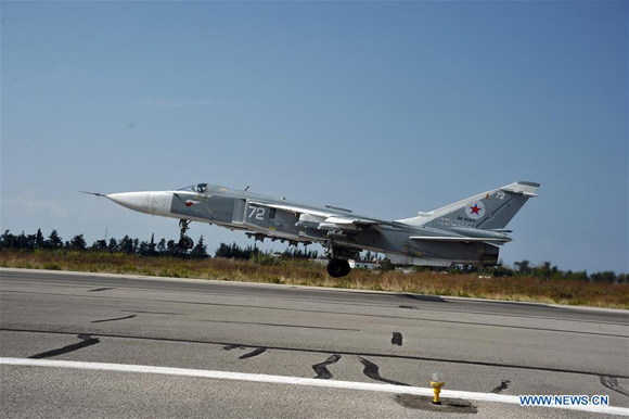 Photo taken on Oct. 21, 2015 shows Russian Sukhoi Su-24 taking off from the Hmeymim airbase in the Latakia province, Syria. [Photo/Xinhua]